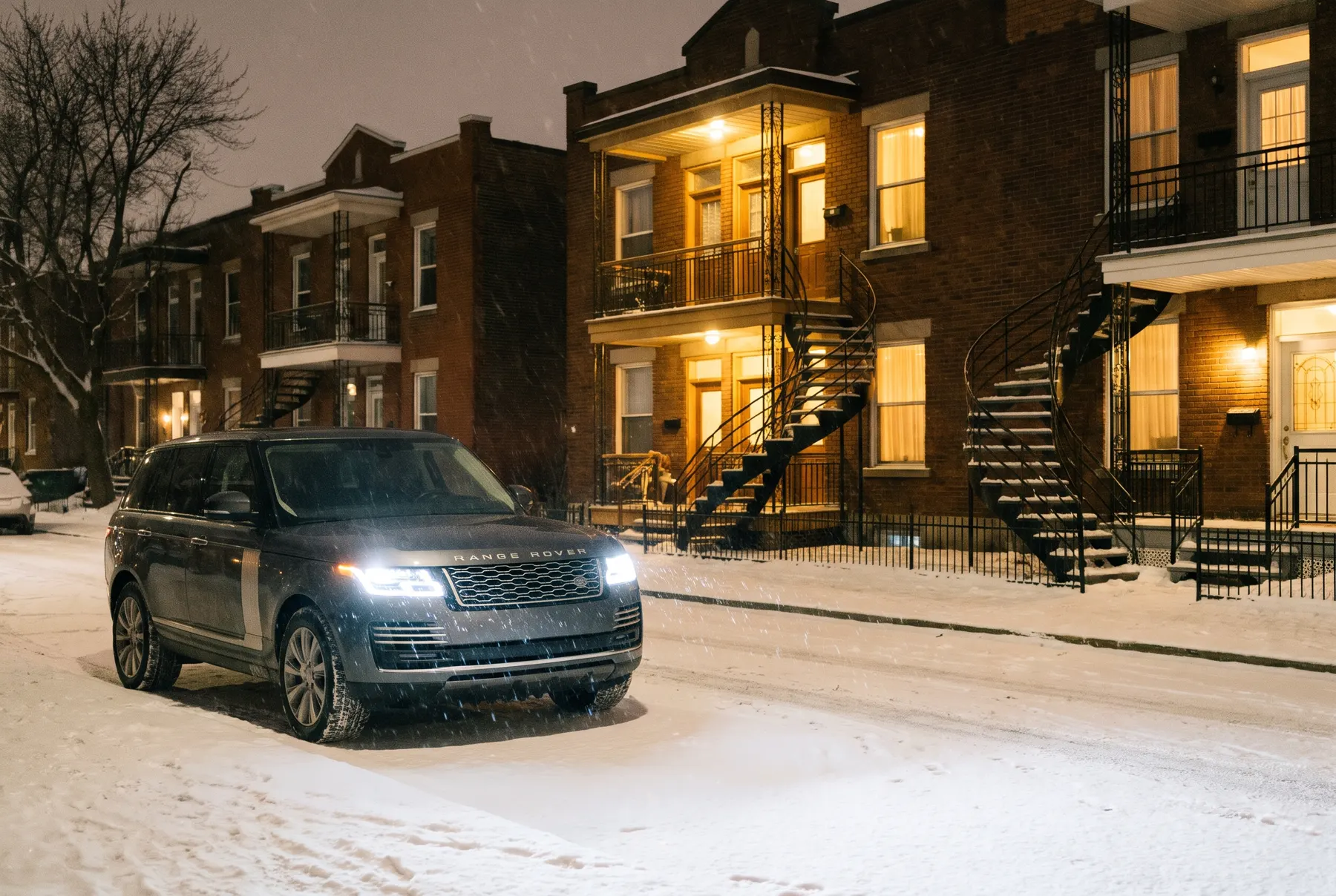 Range Rover on a snowy Plateau street with spiral staircases